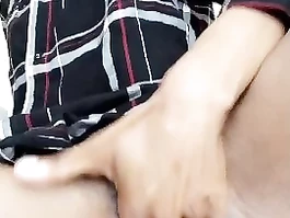 Horny young girl is sitting in front of the webcam and hotly masturbating